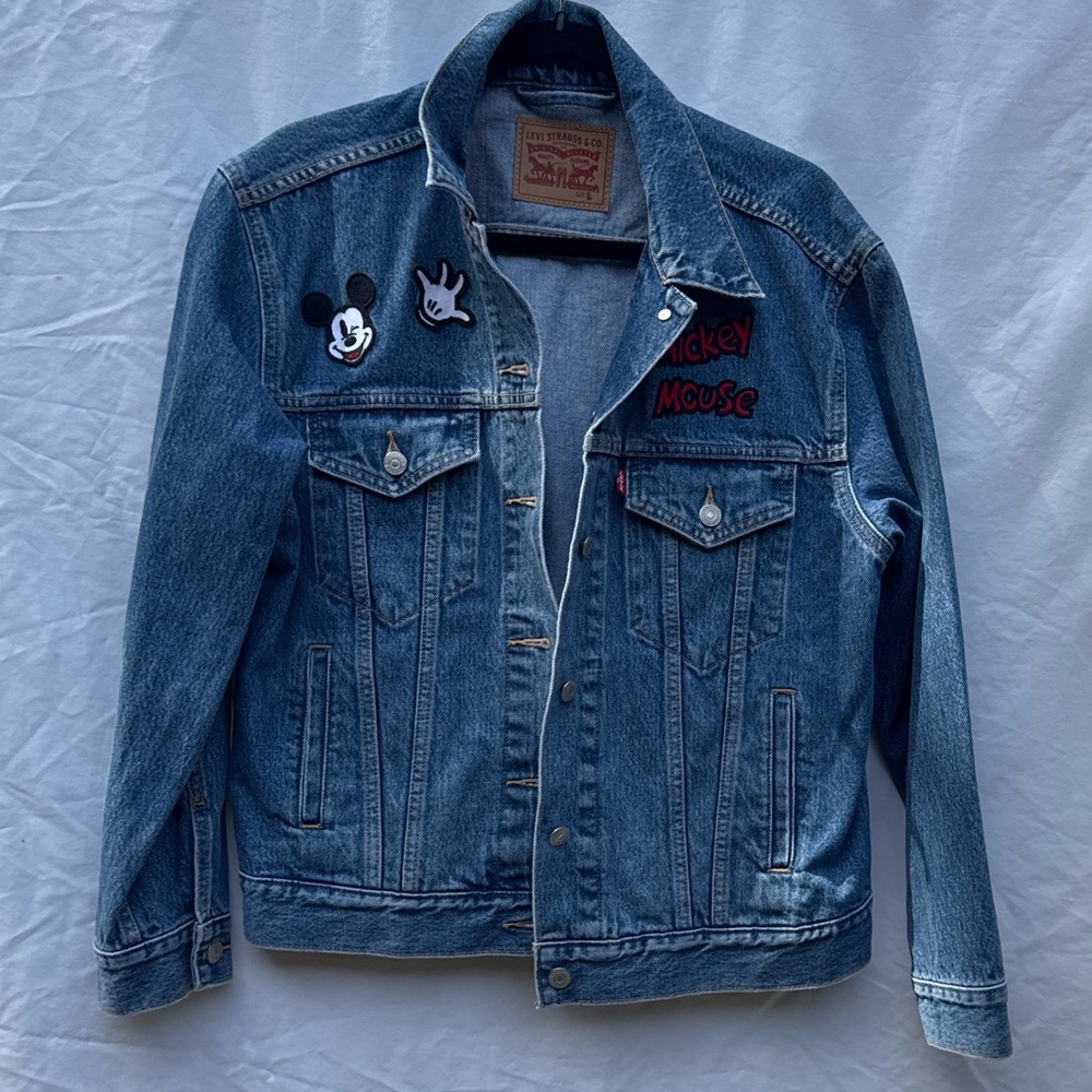 Levi’s classic blue denim jacket with fun Mickey Mouse patch details, size L.